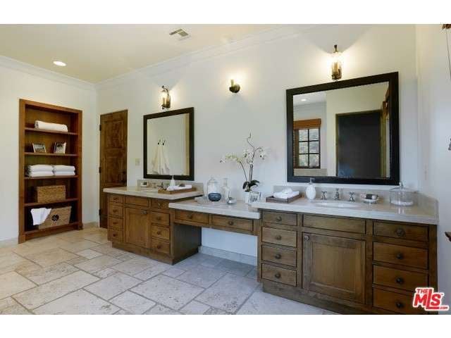 The rustic wood details continue into the gracious bathroom.