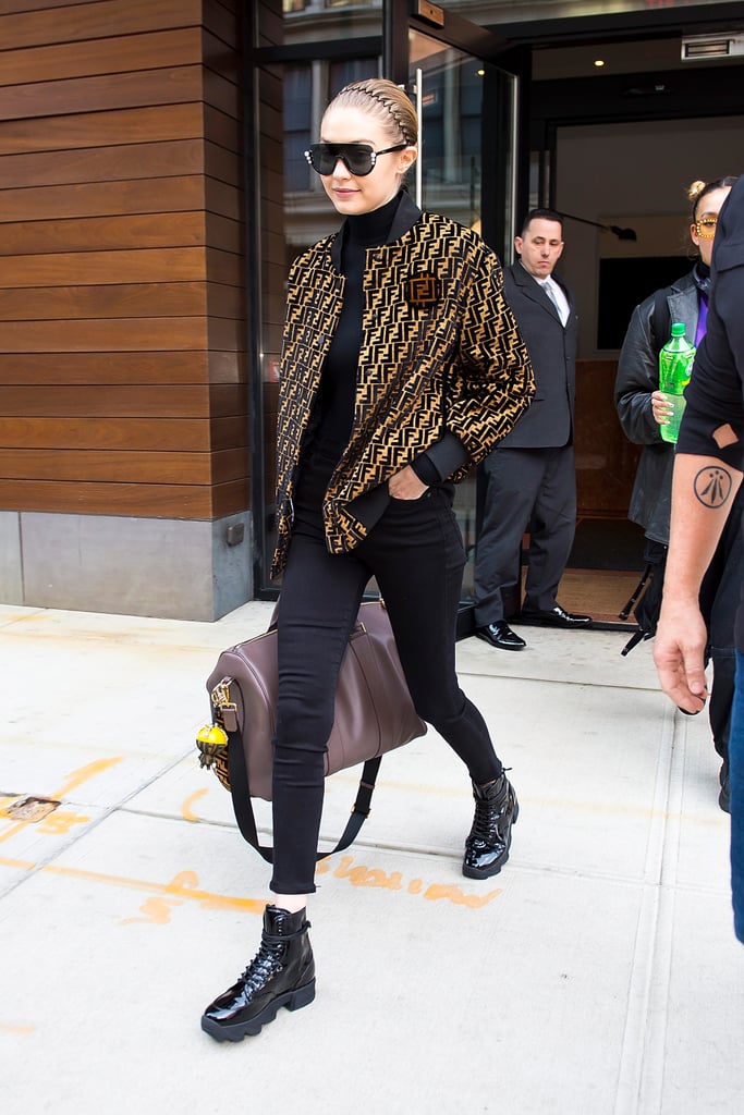 Gigi was decked out in Fendi, from her sunglasses to jacket and duffel bag.