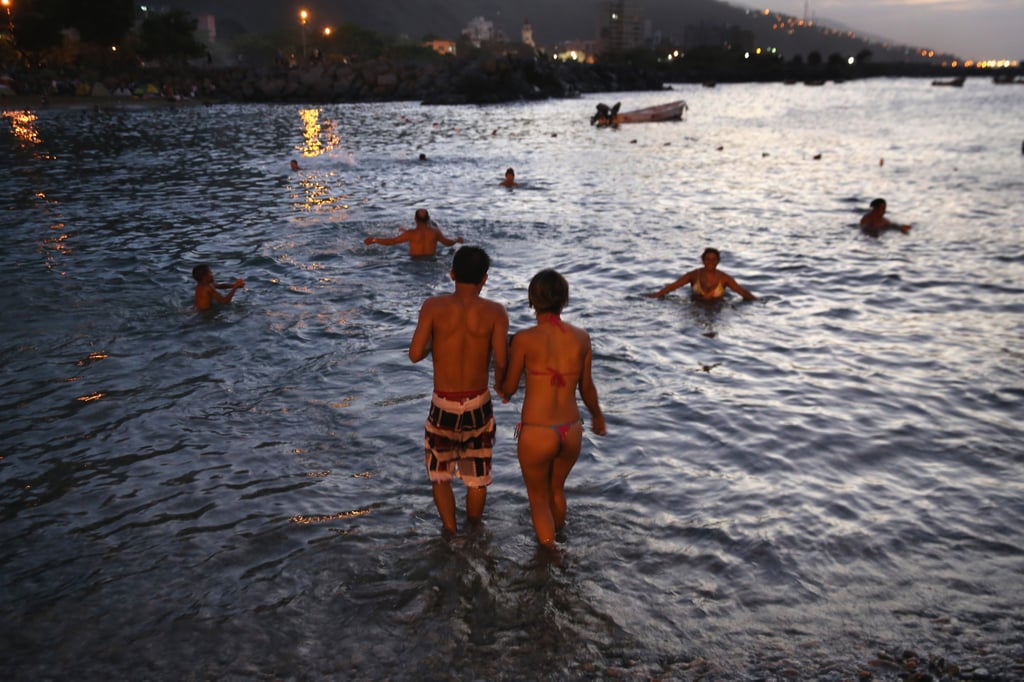 In Venezuela, a couple took in the Carnival holiday with a sunset dip.