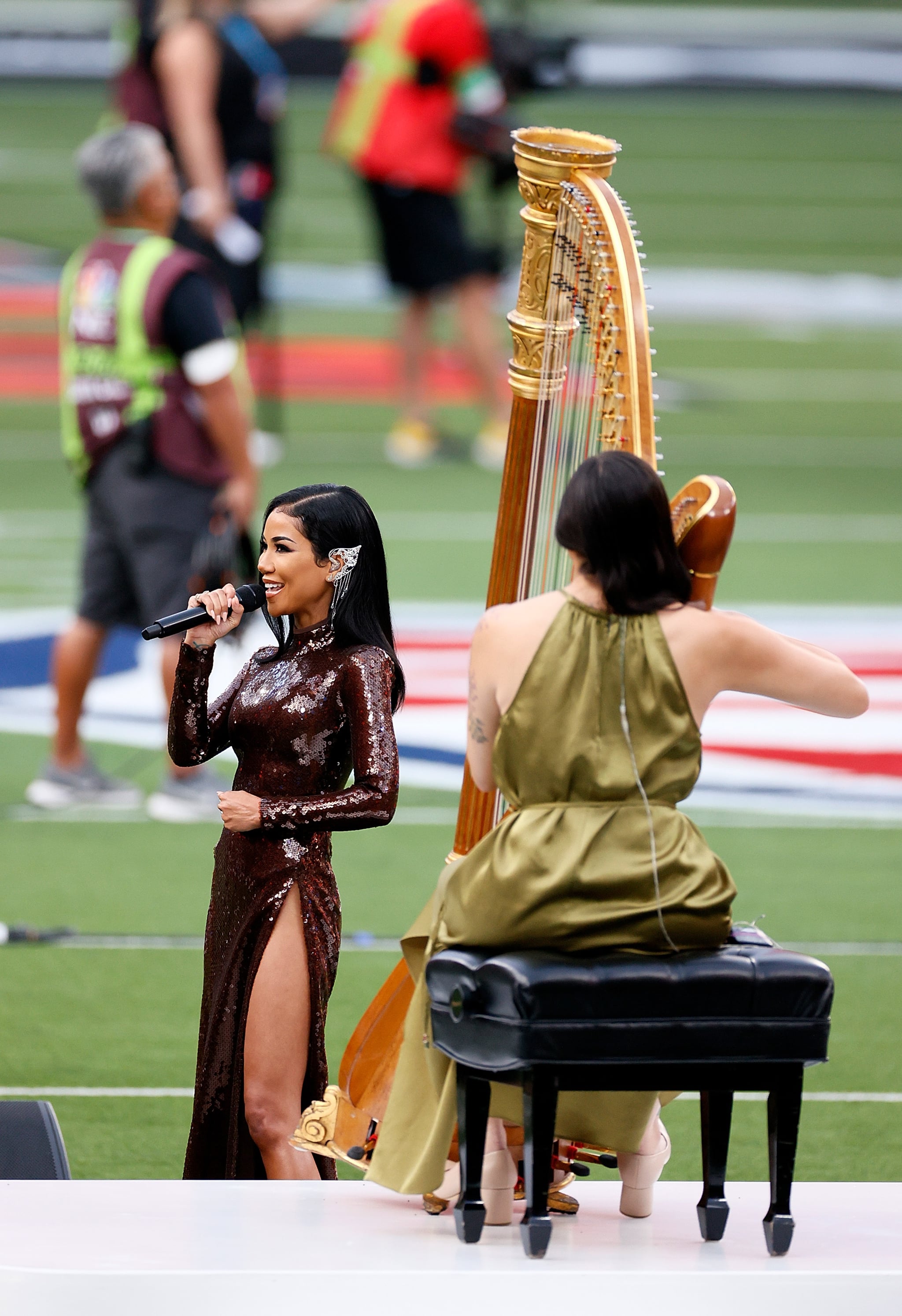 INGLEWOOD, CALIFORNIA - FEBRUARY 13: Singer Jhene Aiko performs America The Beautiful prior to Super Bowl LVI between the Los Angeles Rams and the Cincinnati Bengals at SoFi Stadium on February 13, 2022 in Inglewood, California. (Photo by Steph Chambers/Getty Images)