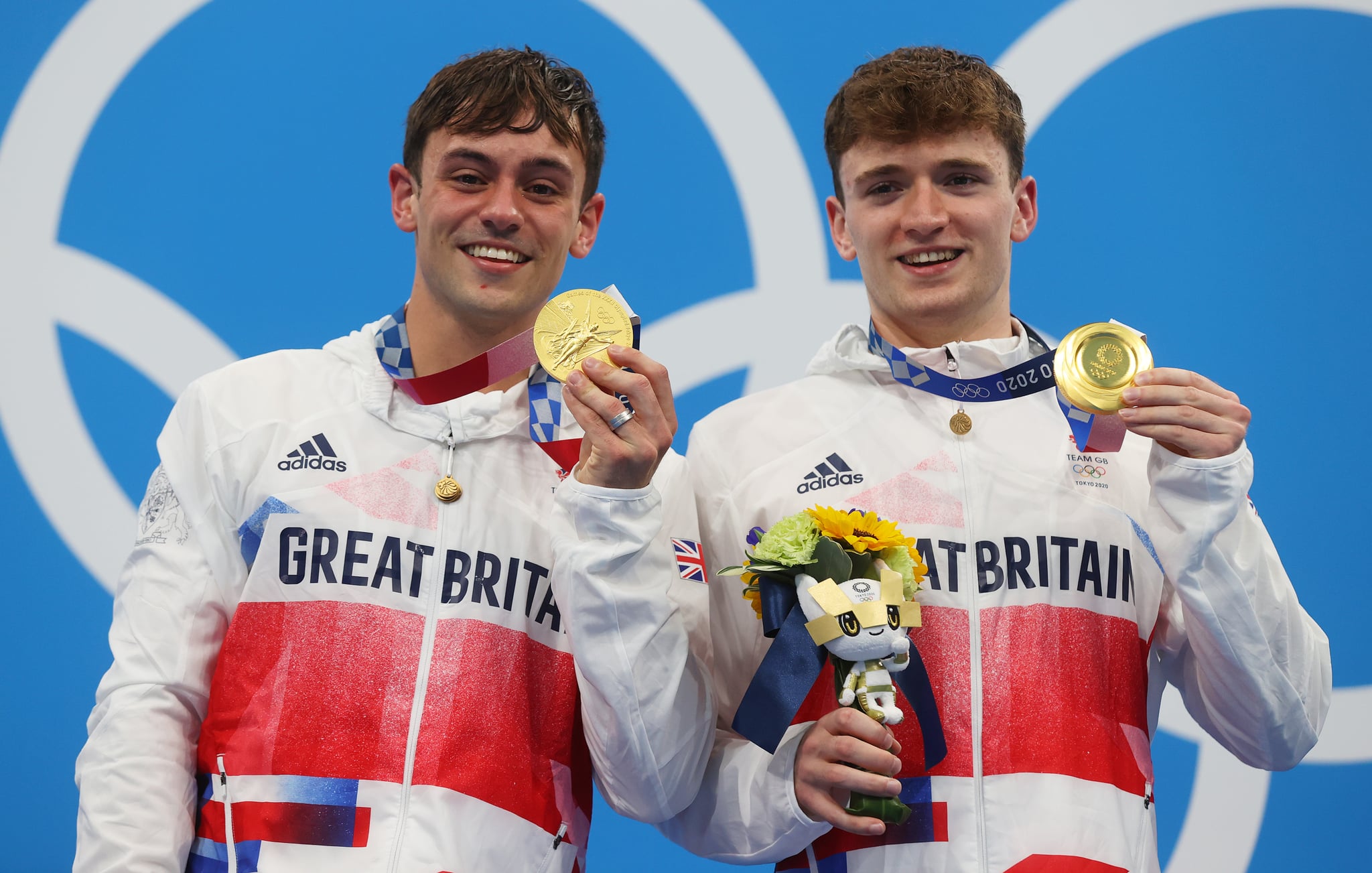 TOKYO, JAPAN - JULY 26: Matty Lee and Thomas Daley of Team Great Britain pose with their gold medals during the medal presentation for the Men's Synchronised 10m Platform Final on day three of the Tokyo 2020 Olympic Games at Tokyo Aquatics Centre on July 26, 2021 in Tokyo, Japan. (Photo by Clive Rose/Getty Images)