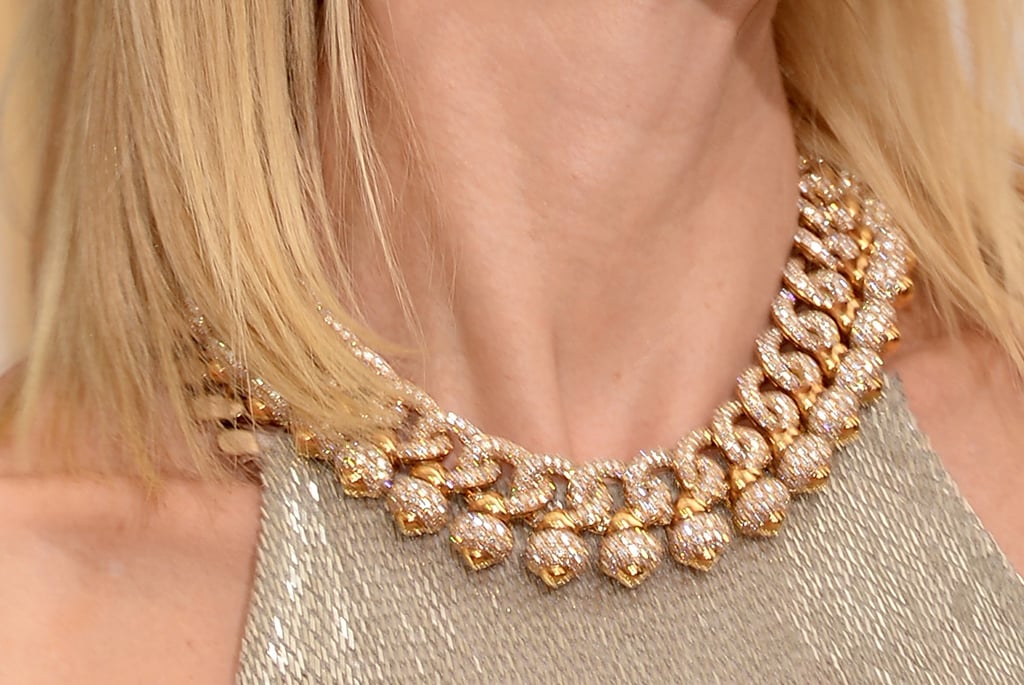 Naomi Watts added glitz with a yellow gold and diamond necklace.