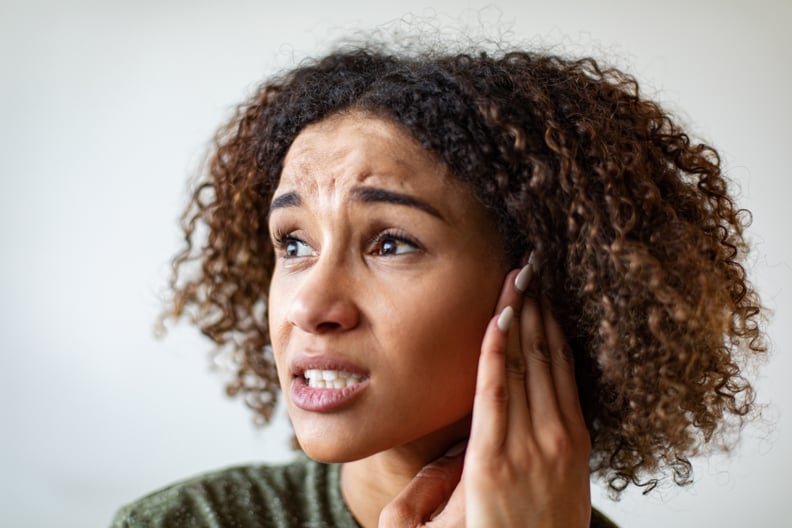 woman dealing with ear itch 
