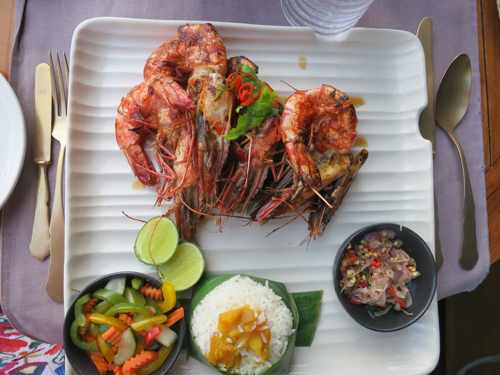 Lunch at the Sangkar Restaurant was memorable for the stunning water views and delicious Balinese food. These giant (and I mean enormous!) grilled shrimp were proof. My dish — called udang pelalah — features tiger prawns, chili, garlic, ginger, stir-fried morning glory, and sambal matah. Balinese cooking is generally pretty healthy featuring well-prepared meats with local spices and lots of rice, which is a main part of the local agriculture.
