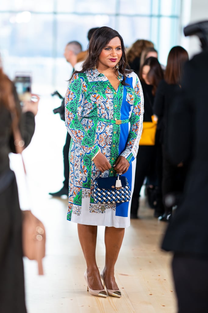 Kaling sat front row at Tory Burch's fall/winter 2019 show in New York City, styling the brand's bright patterned shirtdress with a blue-and-white top-handle bag and metallic cap-toe pumps.