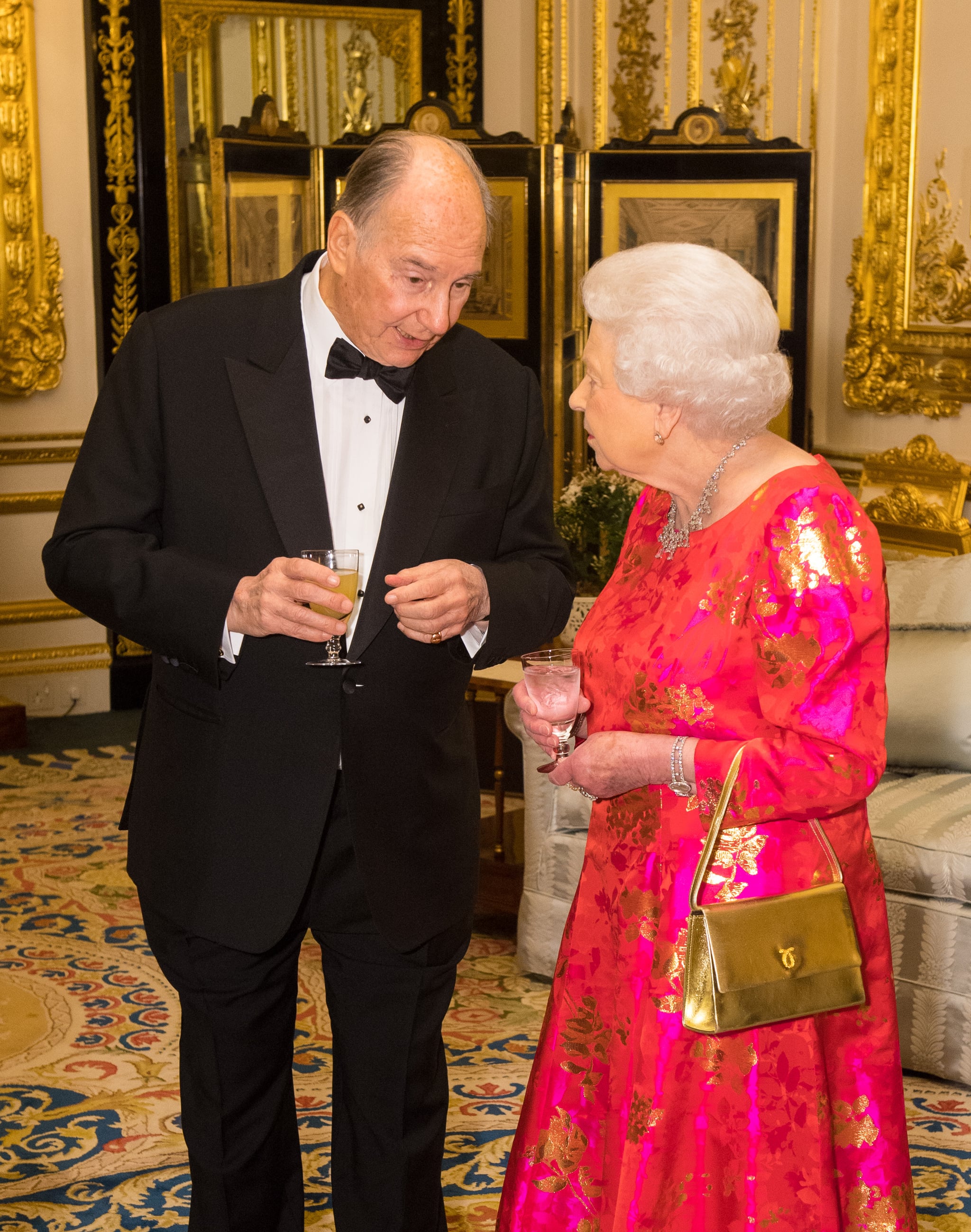 WINDSOR, ENGLAND - MARCH 8: Queen Elizabeth II and Prince Karim Aga Khan IV, prior to dinner at Windsor Castle on March 8, 2018 in Windsor, England. Queen Elizabeth II is hosting  private dinner in honour of the diamond jubilee of his leadership as Imam of the Shia Ismaili Muslim Community. (Photo by Dominic Lipinski-WPA Pool/Getty Images)