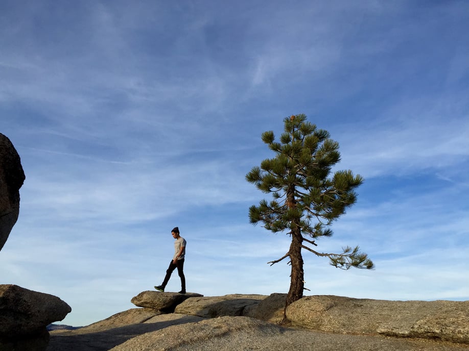 "Keeping subjects on parallel vertical lines creates a balanced composition. Here, the extension of the subject’s leg mimics the nearby tree branch."