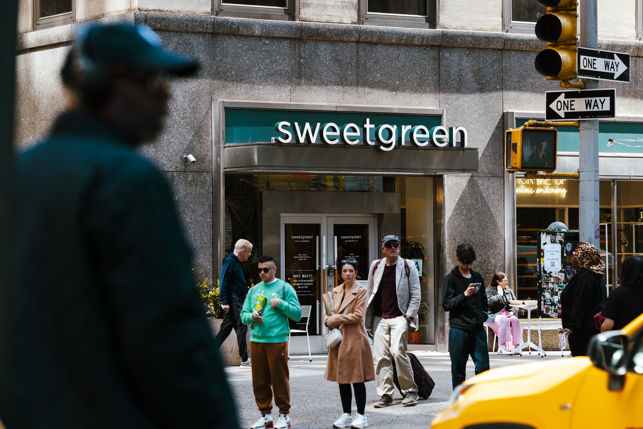A Sweetgreen restaurant on a busy New York street. Sweetgreen's spicy cashew dressing is easy to recreate at home for anyone who doesn't want to brave the stores.