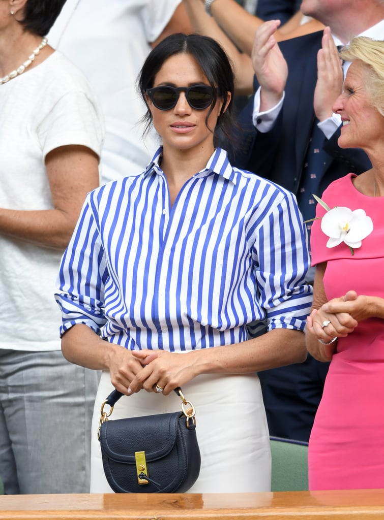 When Meghan attended the Wimbledon tennis championships in London in July 2018, she coordinated a striped Ralph Lauren shirt with chic white pants from the label, toting her Altuzarra bag.