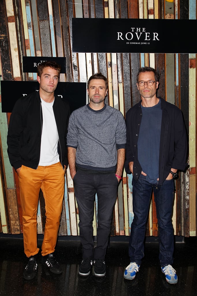Robert Pattinson posed at a photocall for The Rover with director David Michod and costar Guy Pearce in Sydney on Friday.