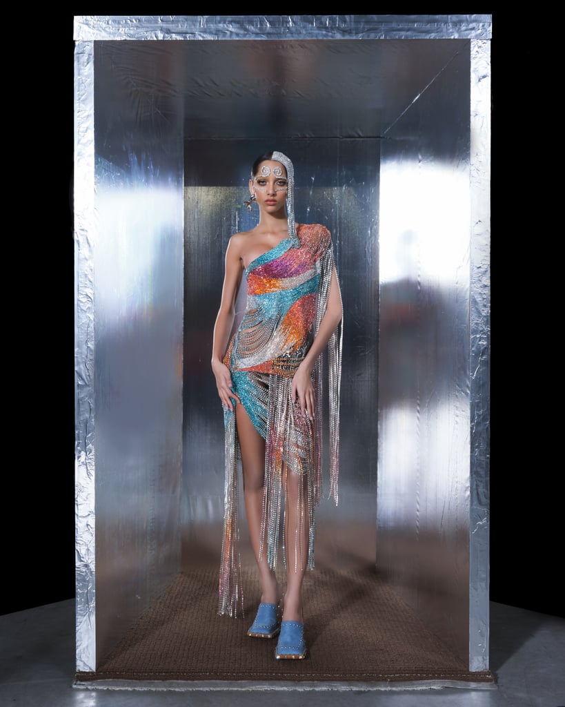 "We wanted to create liquid-like looks by fusing a range of rich colors like sun, fuchsia, aqua, going into crystal clear and back into color, the drapes follow the body elegantly and start opening up around the hips and cascade into fringe,"  Fogg and Panszczyk said.