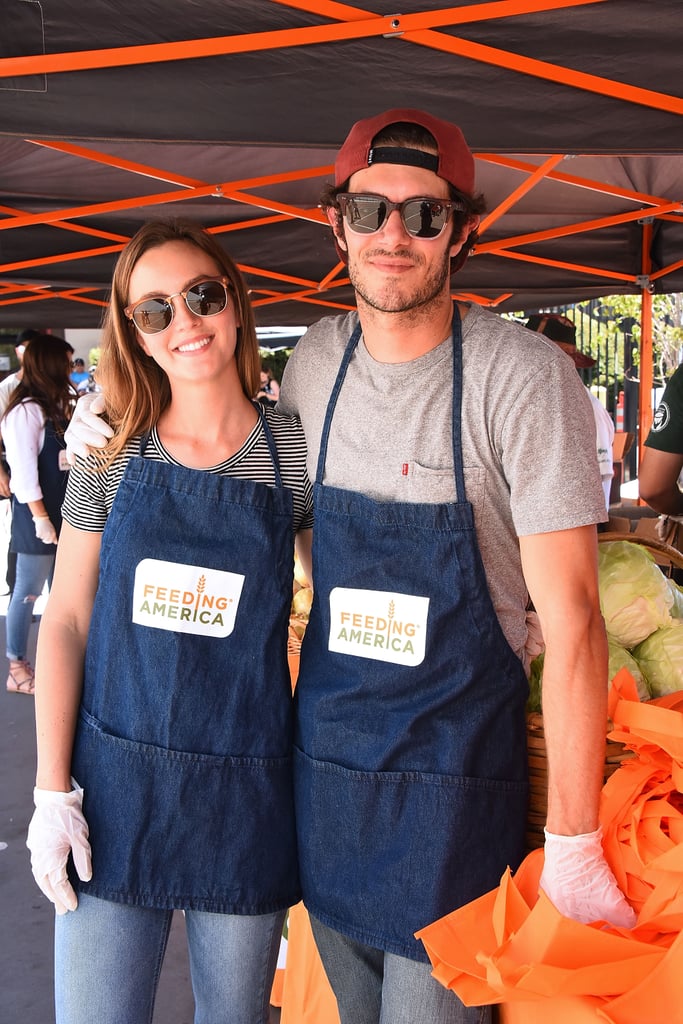 Leighton Meester and Adam Brody are usually pretty private about their romance, but they recently blessed us with a very rare, but very sweet joint appearance on Monday when they volunteered at Feeding America's Summer Hunger Awareness event in LA. The couple, who got married in 2014, were all smiles as they served lunch to schoolchildren as part of the initiative, which brings awareness to hunger and the millions of children who rely on school lunches every day. Aside from posing for a few pictures with fellow volunteer Tiffani Thiessen, the parents of daughter Arlo weren't afraid to take off their gloves and have an adorable arm-wrestling match with one of the young boys. Could they be any more perfect together?