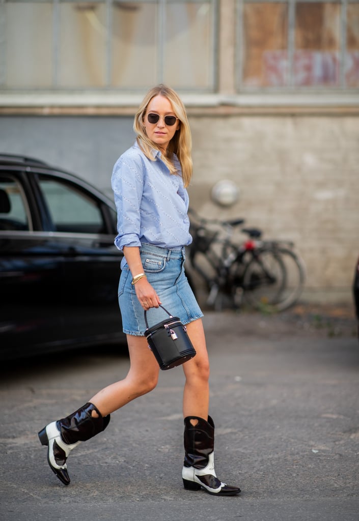 Add a trendy bucket bag to the always iconic denim skirt and cowboy boot pairing.