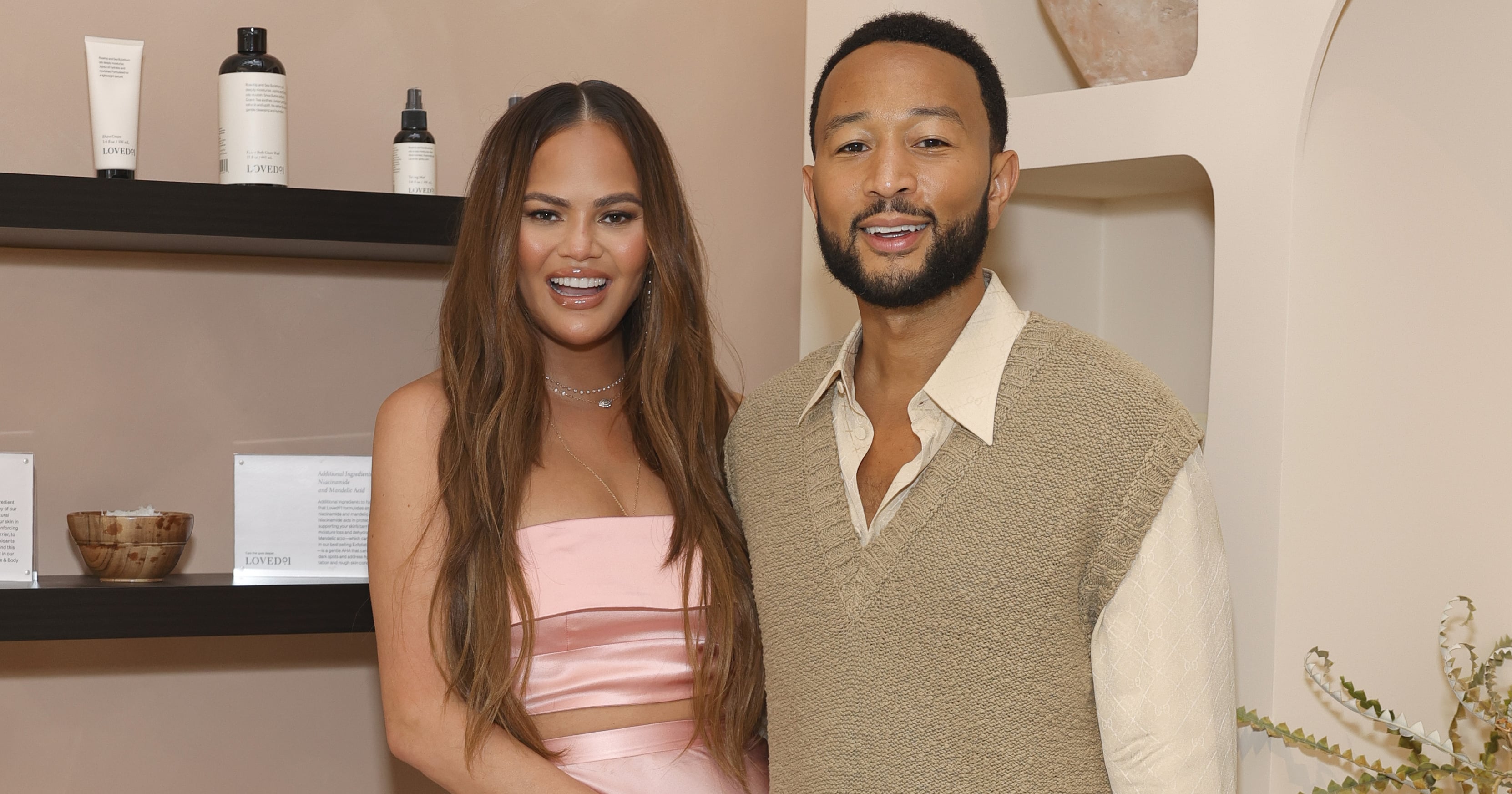 Chrissy Teigen Wears a Strapless Pink Silk Set For Night Out