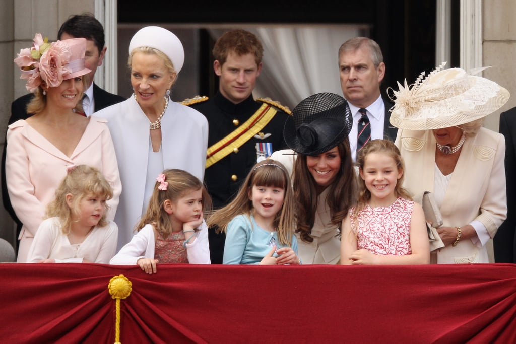 As the family gathered on the balcony, Kate leaned in to talk to the younger girls.