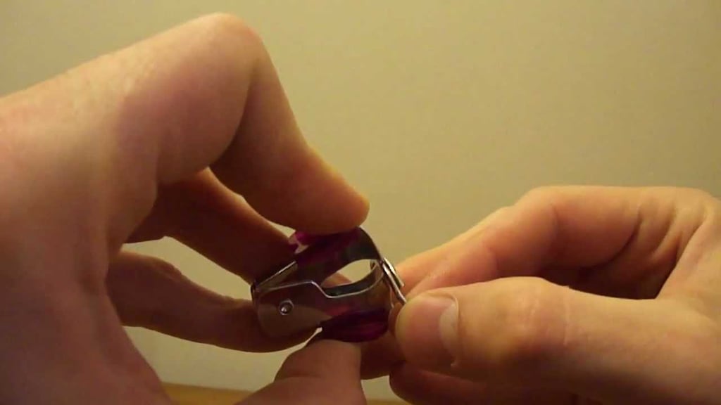 Open a key ring with a staple remover.