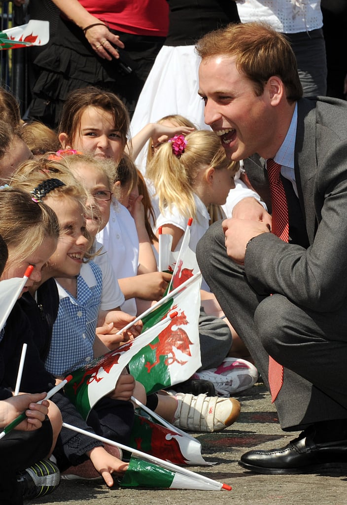 Will knelt down to chat with a group of little cuties during a May 2008 visit to the Valley Kids Project in England.