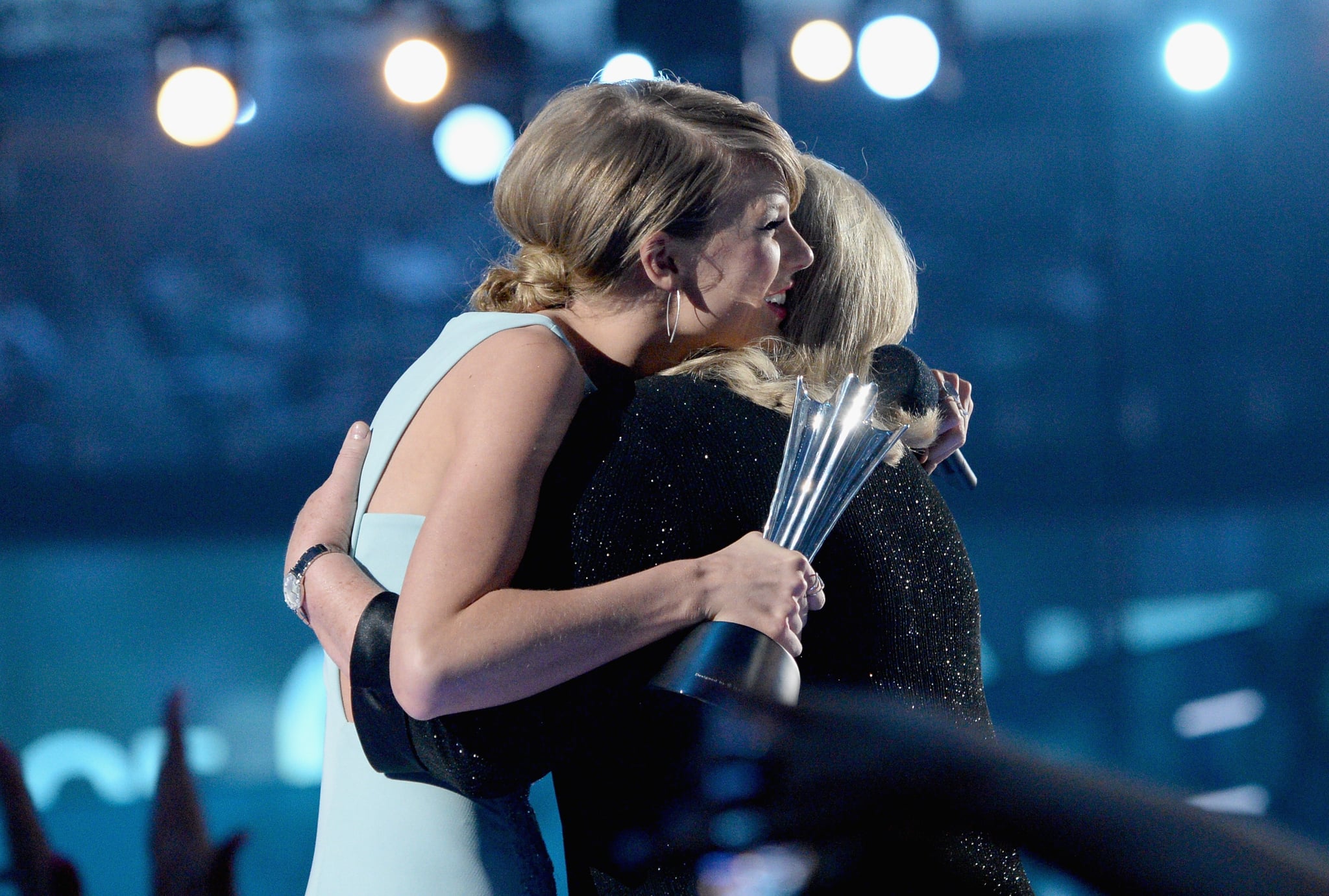 ARLINGTON, TX - APRIL 19:  Honoree Taylor Swift (L) accepts the Milestone Award from Andrea Finlay onstage during the 50th Academy of Country Music Awards at AT&T Stadium on April 19, 2015 in Arlington, Texas.  (Photo by Mike Windle/ACM2015/Getty Images for dcp)