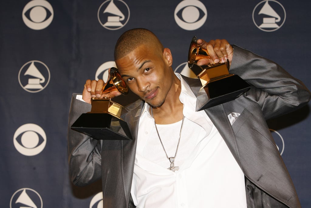T.I. posed with his Grammys in the press room.