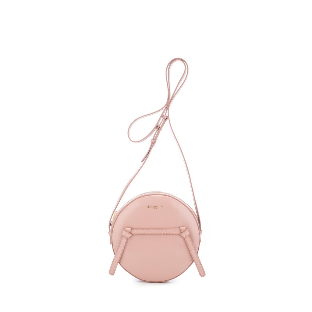 "Jennifer Meyer–jewelry alumna, Nikki Erwin, just launched a line of easy-chic handbags you'll likely spot on her celebrity fans, like Olivia Wilde and Blake Lively. It's not hard to see why: her Donatienne 2.0 bags, like this Amy Faded-Rose Crossbody ($395), are a chic way to upgrade your everyday bag with a fresh Spring palette." — HWM