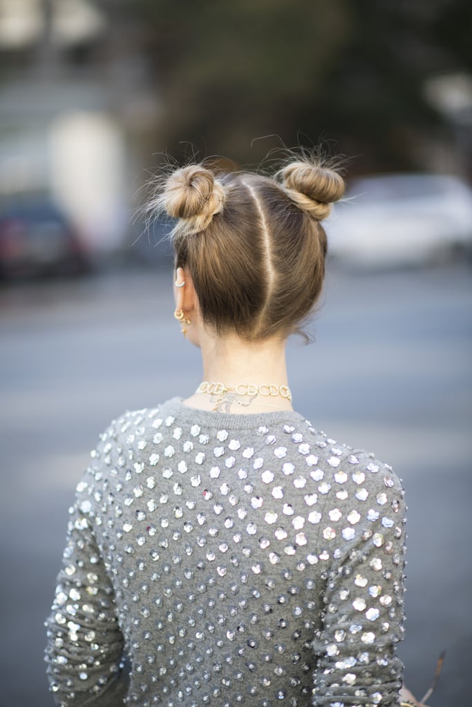 She's just being Miley . . . Rock double buns with a perfectly symmetrical part.