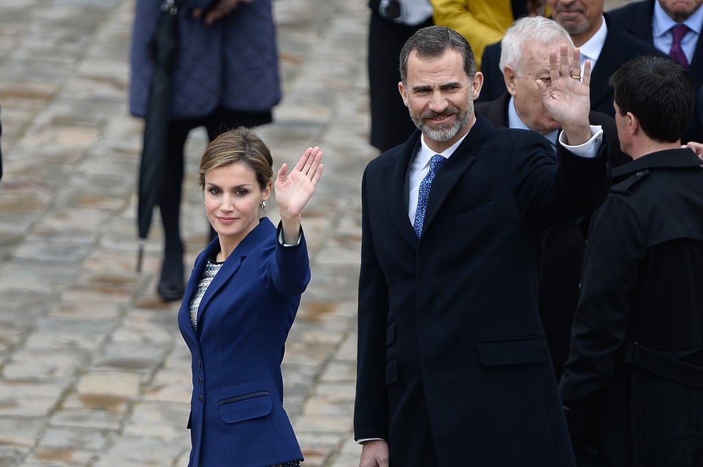 Looking dapper, Letizia and Felipe wave at their fans.