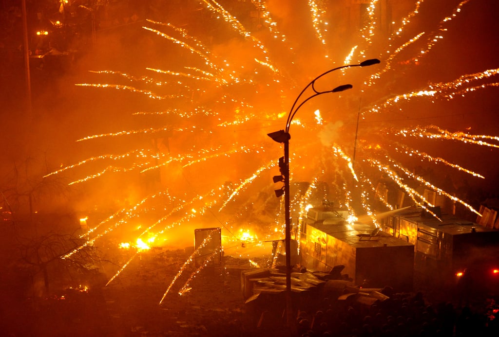 Fires burned as protesters clashed with police in Kiev.