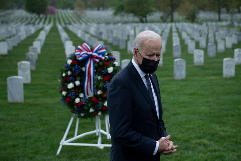 US President Joe Biden speaks to the press at Arlington National Cemetery's section 60, where many of those killed serving in Afghanistan are buried, April 14, 2021, in Arlington, Virginia. - President Joe Biden announced it's 