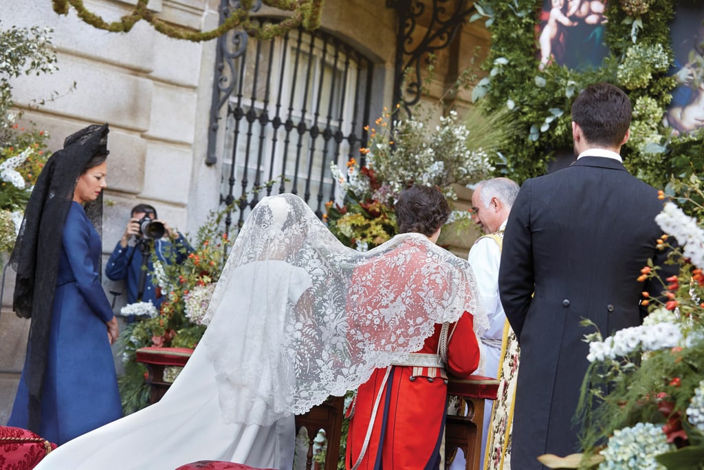 She Also Wore a Lace Veil During the Ceremony