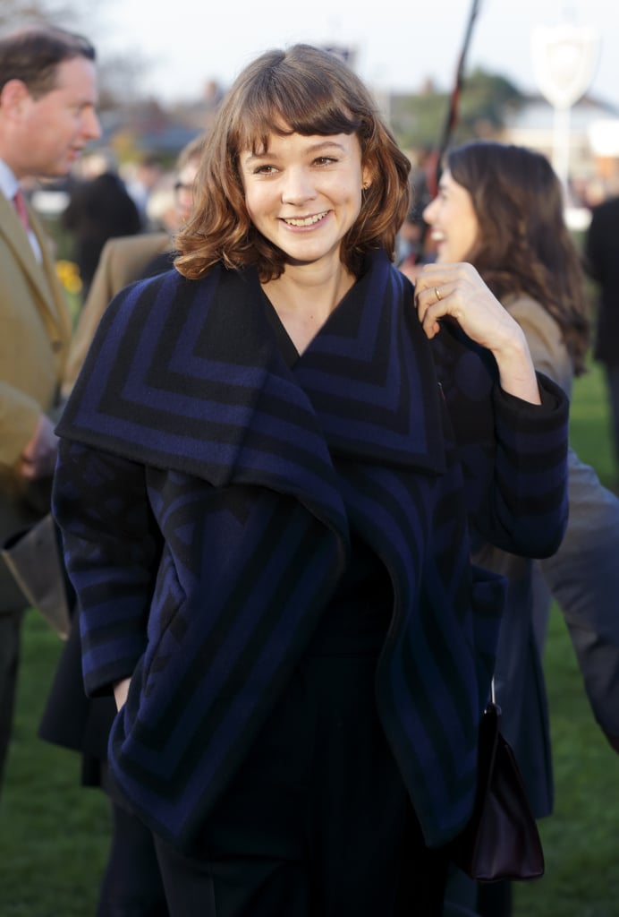 On Saturday, Carey Mulligan lit up with a smile during the Hennessy Gold Cup at Newbury Racecourse in Newbury, England.