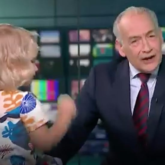 Little Girl Climbs on a Desk During the Nightly News