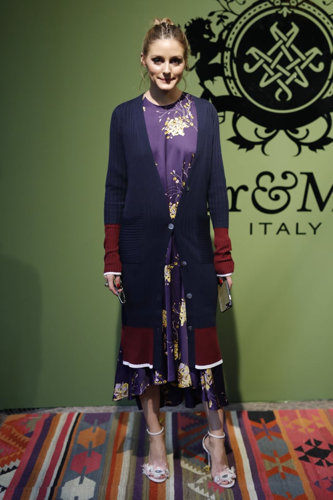 For a presentation in Milan, Olivia mixed and matched a colorblock cardigan over a floral dress.
