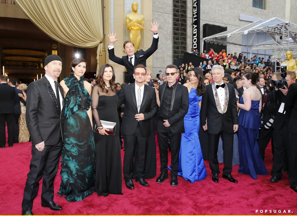 In one of the best photobombs of the night, Benedict Cumberbatch leaped behind U2 on the red carpet.