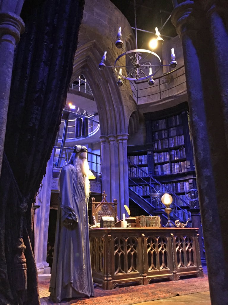 There's so much to see in the headmaster's office, including Dumbledore's costume, loads of books, paintings, and the Sorting Hat tucked away on one of the bookshelves.