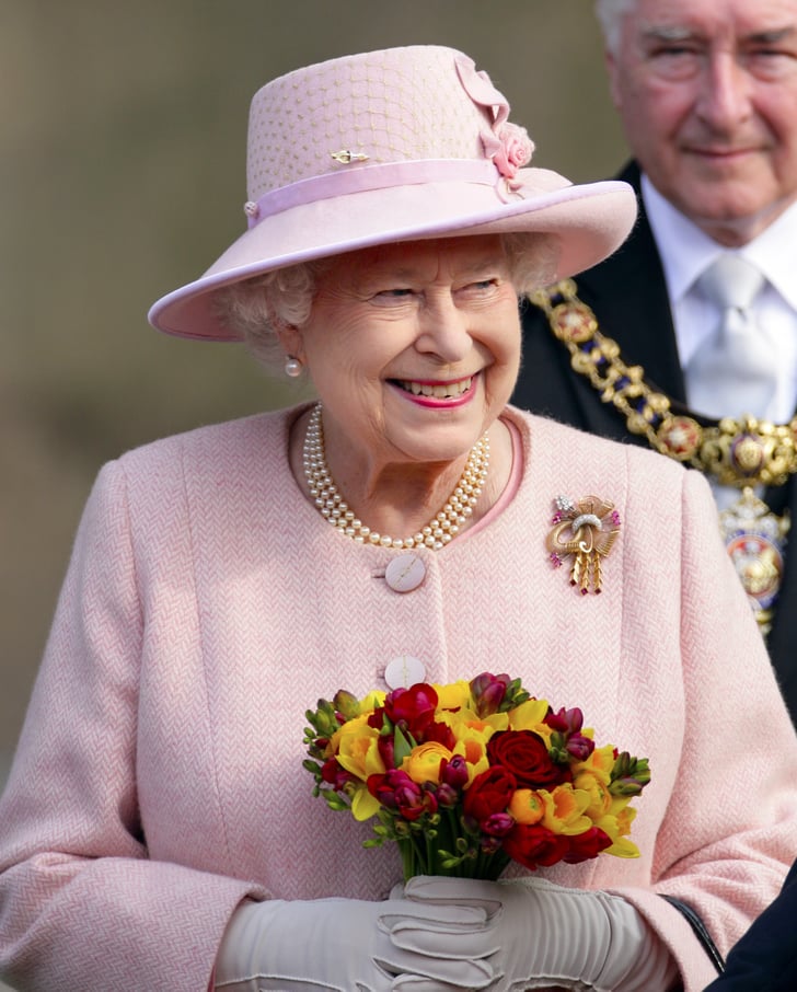 Queen Elizabeth II carried a posy of flowers as she left ...