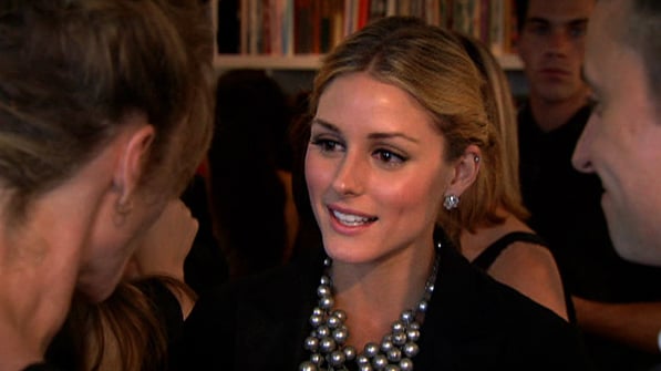 Balance a big necklace with a classic blazer.