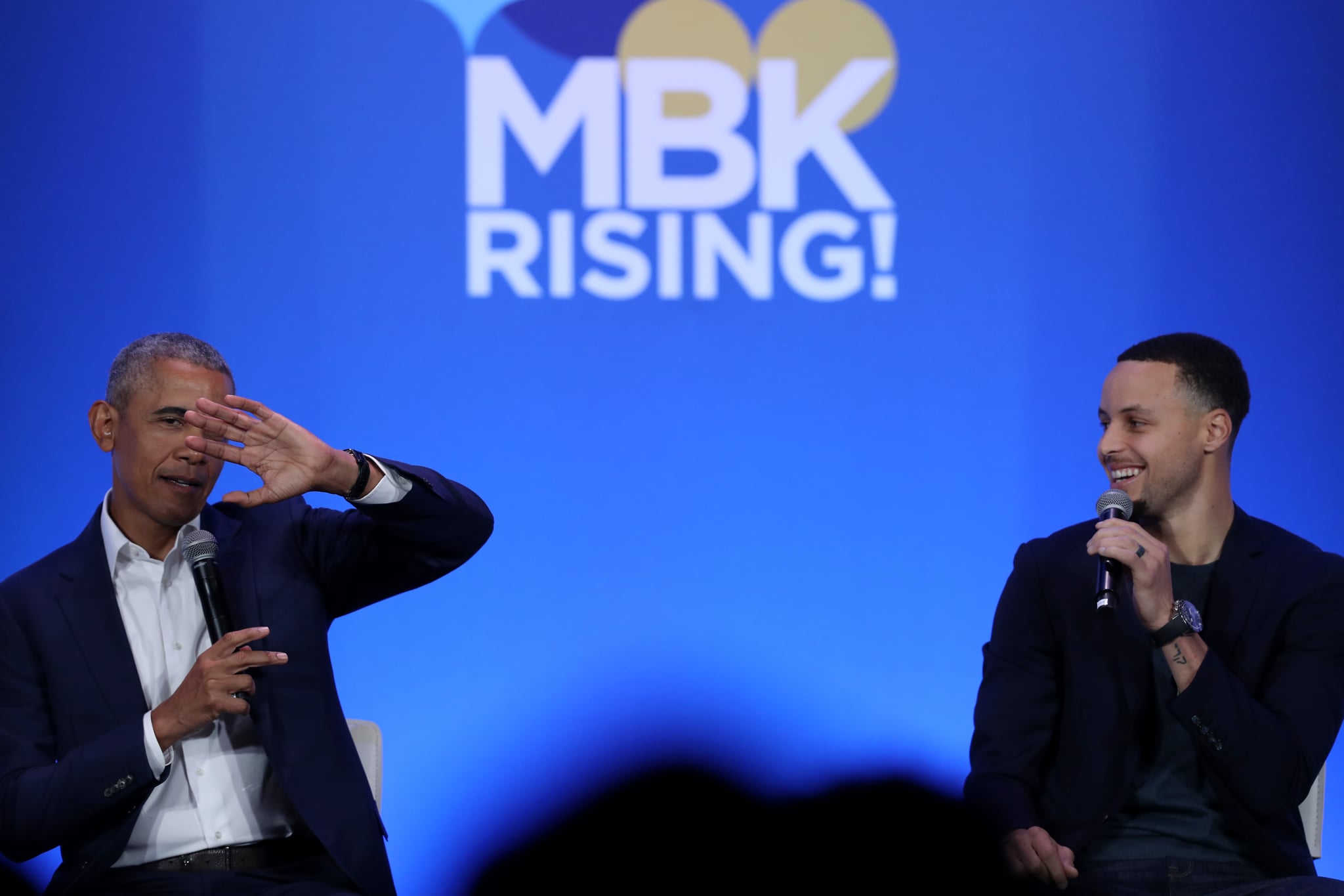 OAKLAND, CALIFORNIA - FEBRUARY 19: Former U.S. President Barack Obama (L) and Golden State Warriors player Stephen Curry speak in conversation during the MBK Rising! My Brother's Keeper Alliance Summit on February 19, 2019 in Oakland, California. MBK Rising! is bringing together hundreds of young men of colour, local leaders and organisations that are working to reduce youth violence, create impactful mentorship programs, and improving life for young men of colour. The My Brother's Keeper initiative was started by President Barack Obama following the death of Trayvon Martin. (Photo by Justin Sullivan/Getty Images)