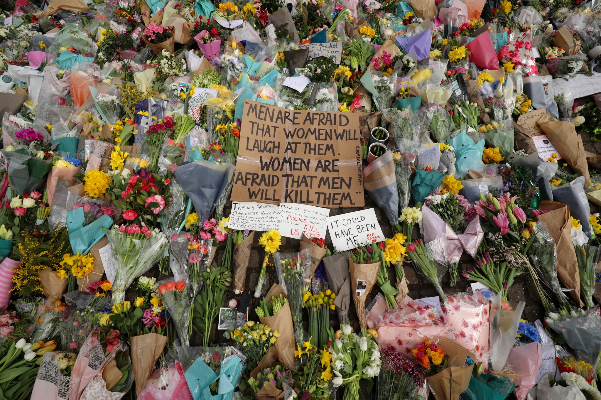 LONDON, ENGLAND - MARCH 15: Floral tributes and messages are placed in tribute to Sarah Everard at Clapham Common on March 15, 2021 in London, England. Hundreds of people turned out at Clapham Common on Saturday night to pay tribute to Sarah Everard, a 33-year-old London resident whose kidnapping and death - allegedly at the hands of an off-duty Metropolitan Police officer - prompted a wave of concern over women's safety. The same police force is being criticised for its response to the vigil, where they forcibly arrested several participants for violations of pandemic-era rules on public assembly. (Photo by Dan Kitwood/Getty Images)