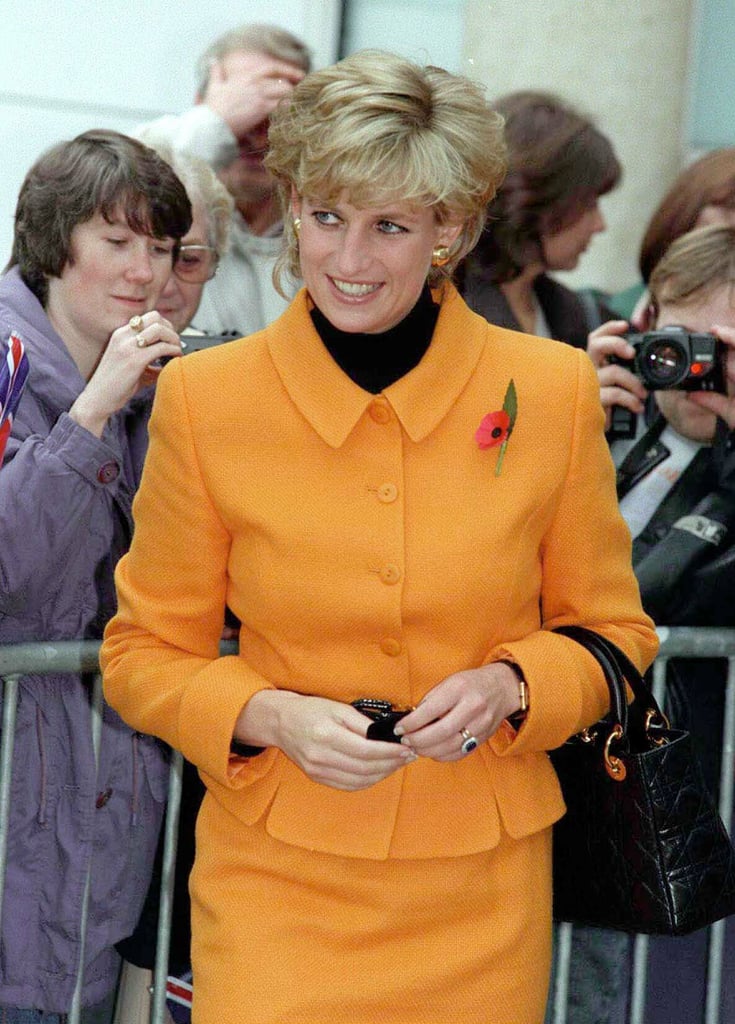 In Liverpool in 1995, styled with a marigold Versace suit.