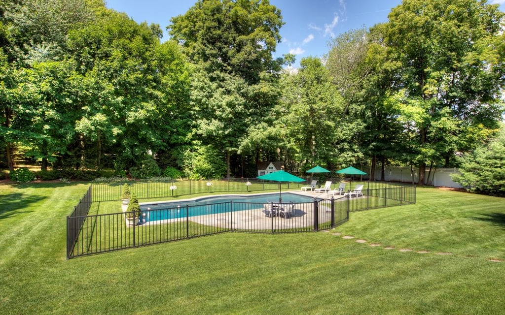 A large pool takes center stage in the one-and-a-half-acre property.