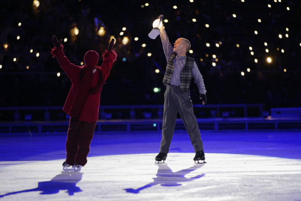 Ice skater Scott Hamilton took the spotlight, lantern in hand.