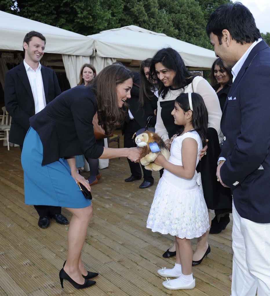 While taking in a June 2012 performance of The Lion, the Witch, and the Wardrobe in London, Kate was presented with a toy lion by a little girl, which she accepted with a smile.