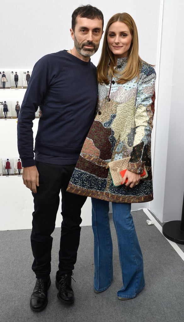 Leave it to Olivia to layer flared light-wash jeans and a colorful trapeze jacket for a surprisingly chic combination.