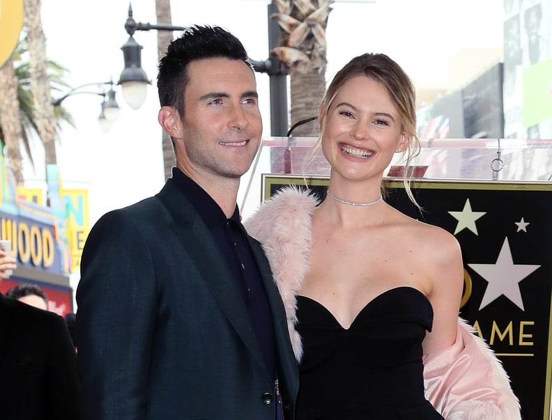 HOLLYWOOD, CA - FEBRUARY 10:  Recording artist Adam Levine (L) and wife model Behati Prinsloo attend his being honored with a Star on the Hollywood Walk of Fame on February 10, 2017 in Hollywood, California.  (Photo by David Livingston/Getty Images)