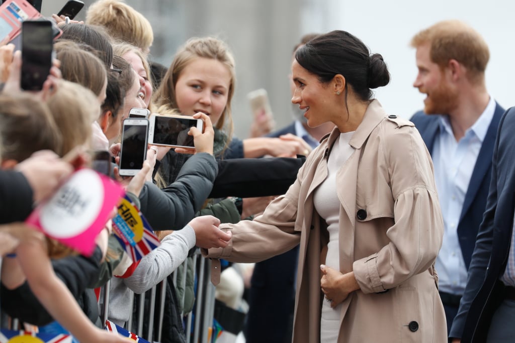 Meghan Markle Touching Baby Bump Pictures