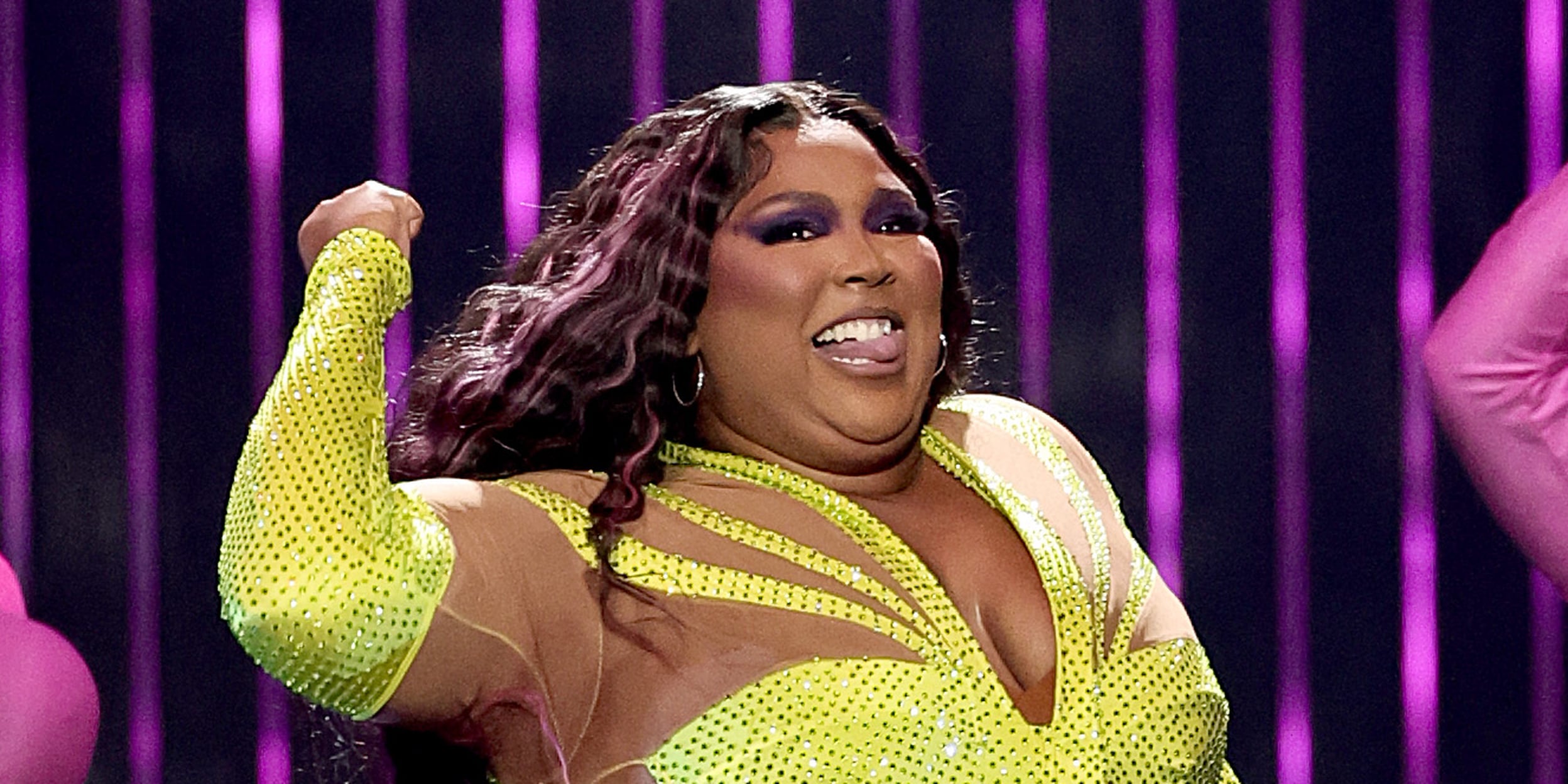 Lizzo wears golden disco ball outfit on stage and navy gown with