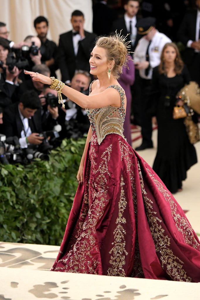 It's Blake Lively's world, and we're all just living in it . . . well, the photographers at Monday night's Met Gala absolutely were! The former Gossip Girl star went full Serena van der Woodsen when she returned to her old stomping grounds at the Metropolitan Museum of Art for the annual fashion event. Blake may be a red carpet expert, but the photographers were in complete awe of her ethereal presence, screaming her name and hollering at her to look a certain way. Yeah, not the best idea, because E! News, who was on the scene at the time, reports that she told photographers to "calm down," gesturing a "simmer down now" hand motion. When someone is wearing a dress that took over "600 hours" to make, you let them look whichever way they want! Check out the hilarious moment ahead.

    Related:

            
            
                                    
                            

            Go Glam or Go Home: Over 100 of the Best Pictures From the 2018 Met Gala