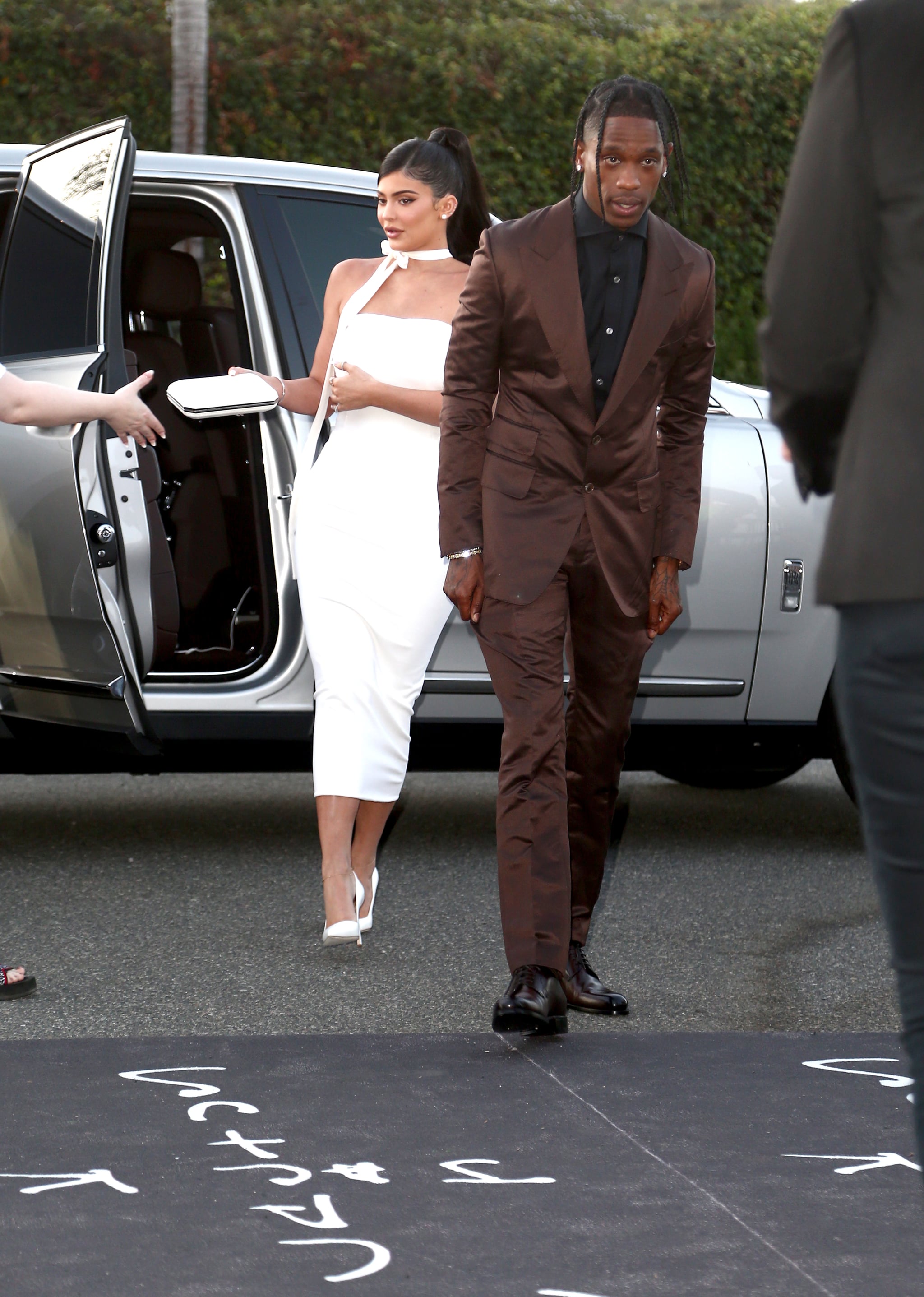 Kylie Jenner And Travis Scott At Travis Scott Look Mom I Can Fly Premiere Travis Scott Couldn T Keep His Hands Off Kylie Jenner In This Skin Tight White Dress Popsugar Fashion