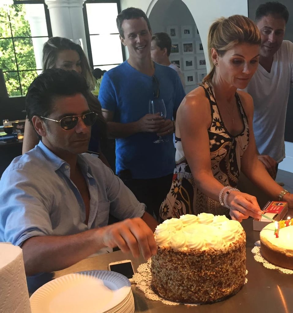 Creator Jeff Franklin shared a party picture, writing, "A pre-birthday party for john with the cast at lori's house. 29 years of Stamos birthday cakes!"