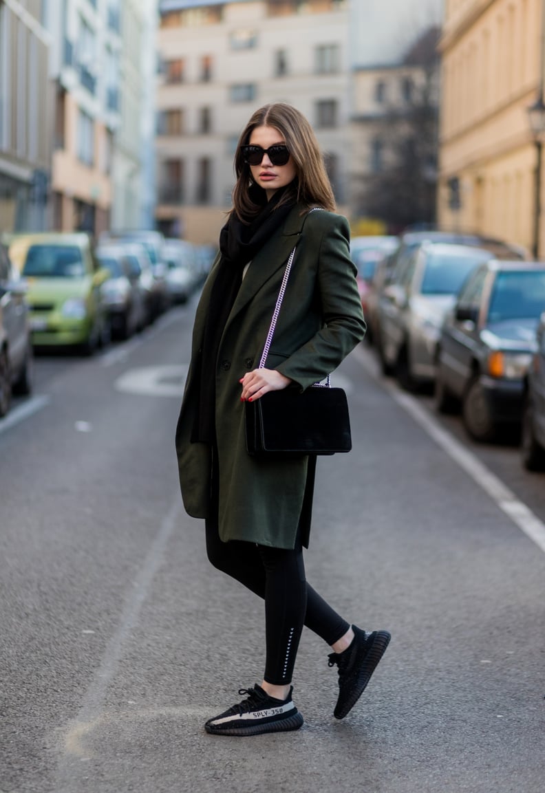 With a menswear jacket, a luxe velvet bag, and cool kid sneakers.